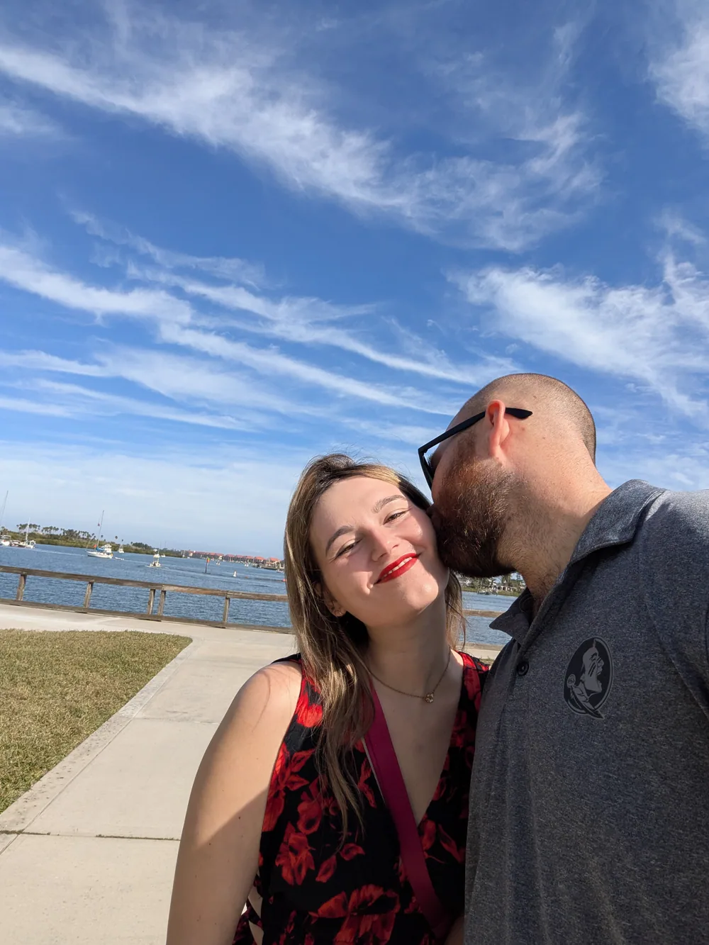 Cody kissing Summer on the cheek during a walk by the water